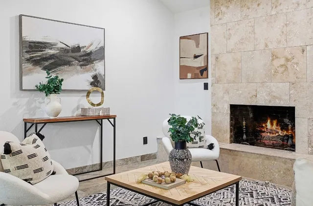 a living room with furniture and a potted plant