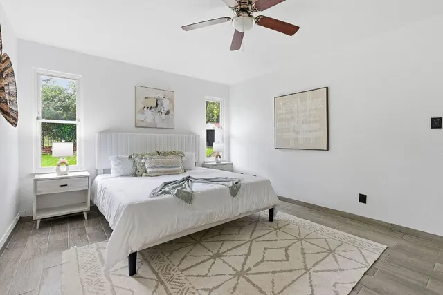 a bed room with a bed and a window