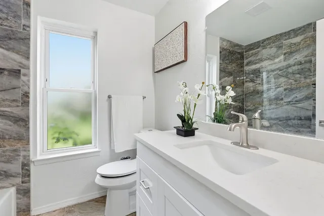 a bathroom with a sink and a toilet