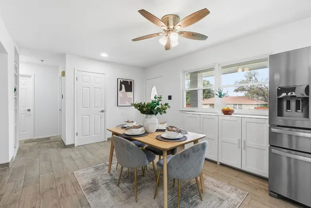 a kitchen with a table and chairs in it