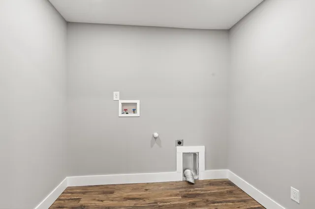 a view of a small space with wooden floor