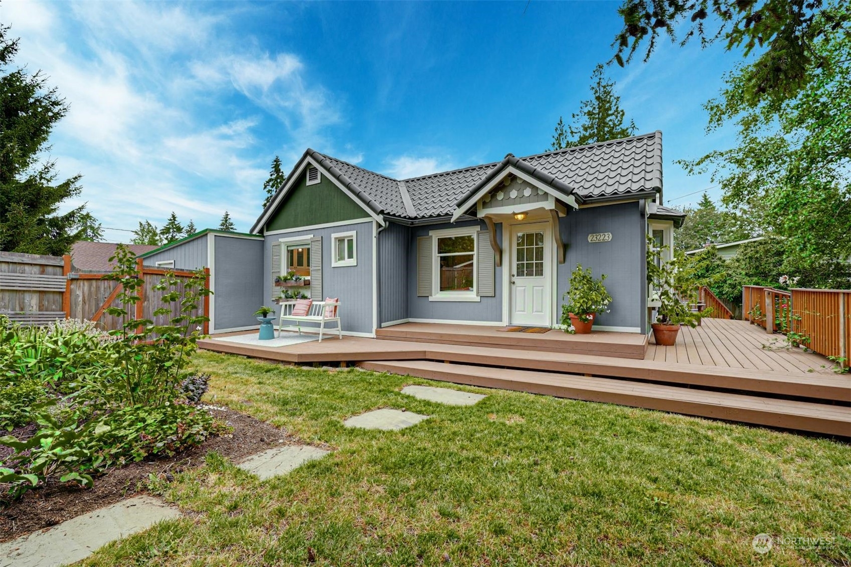 23223 Brier Road Brier, WA 98036 - Photo 1 of 30 a front view of a house with a yard table and chairs