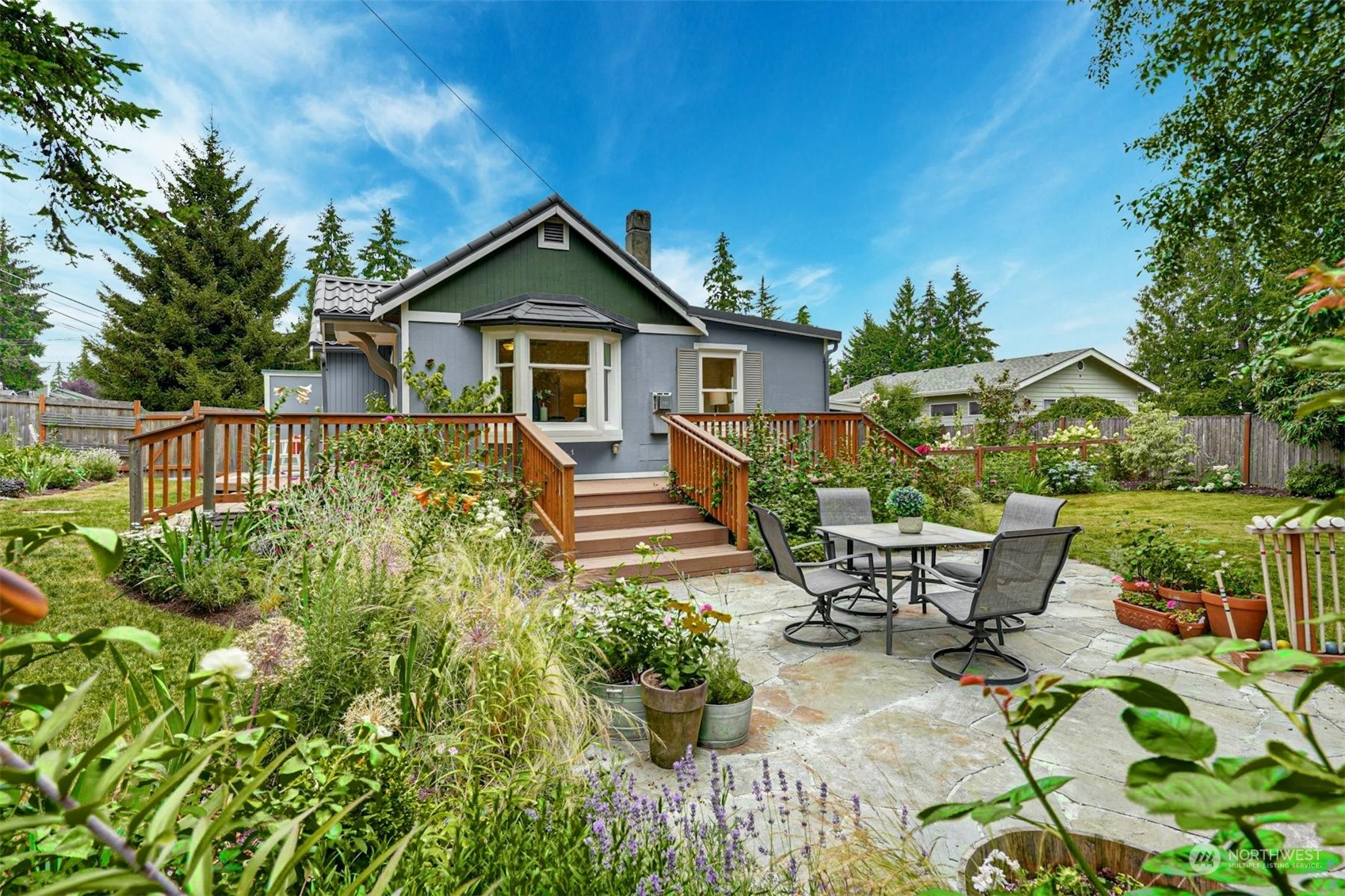 23223 Brier Road Brier, WA 98036 - Photo 20 of 30 a view of a house with wooden deck and furniture