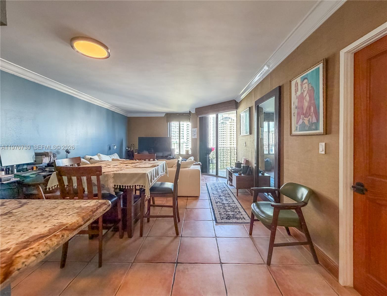 520 Brickell Key Drive, Unit A1912 Miami, FL 33131 - Photo 11 of 28 a living room with lots of furniture and a rug