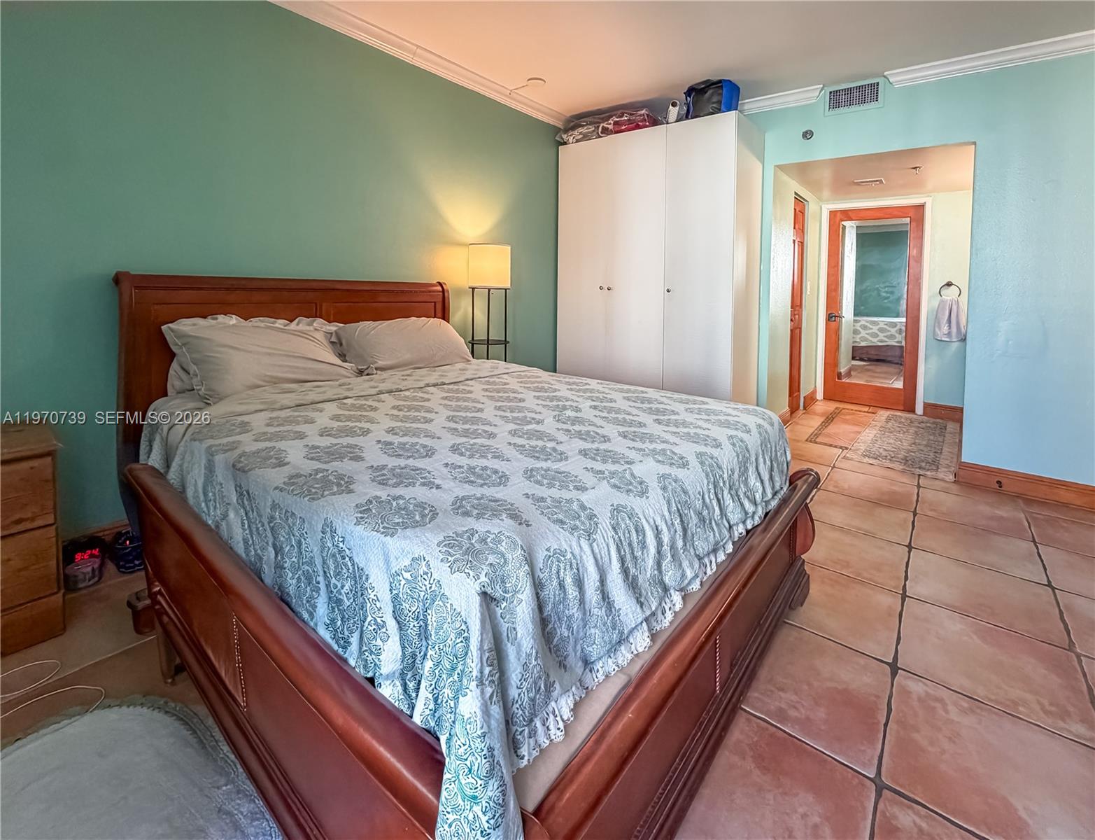 520 Brickell Key Drive, Unit A1912 Miami, FL 33131 - Photo 16 of 28 a bedroom with a bed and a mirror