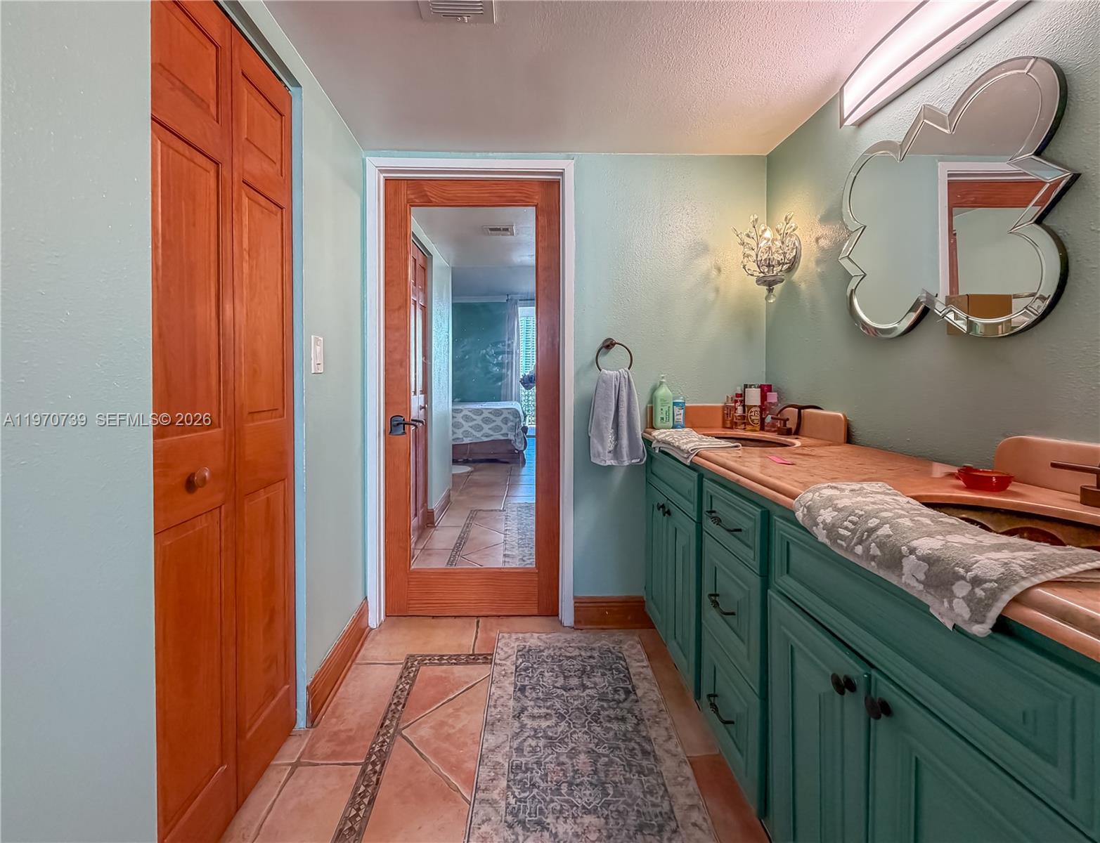 520 Brickell Key Drive, Unit A1912 Miami, FL 33131 - Photo 18 of 28 a bathroom with a granite countertop sink and a mirror