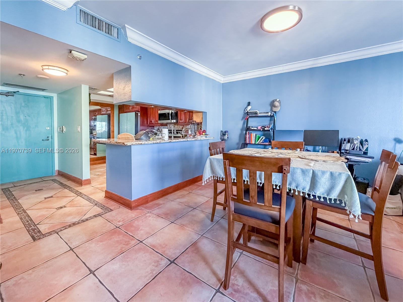 520 Brickell Key Drive, Unit A1912 Miami, FL 33131 - Photo 4 of 28 a dining room with furniture and wooden floor