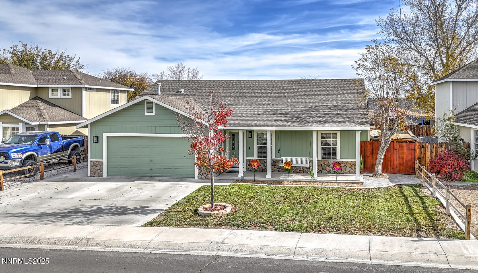a front view of the house with outdoor seating