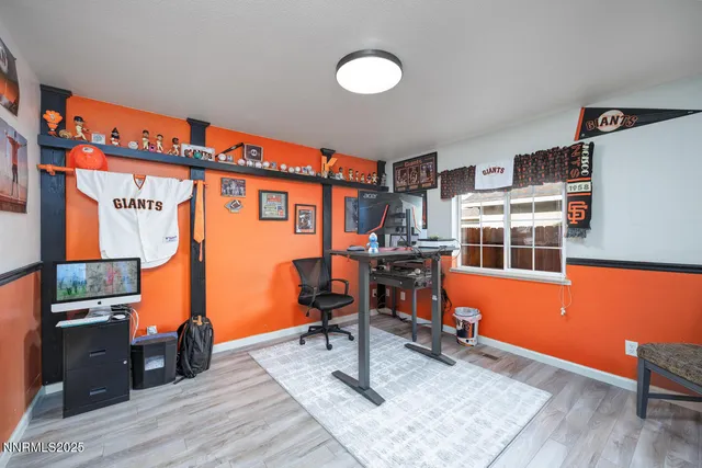 a work room with furniture and wooden floor