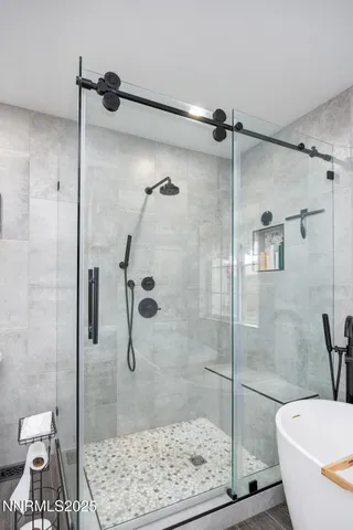 a bathroom with a shower and a toilet