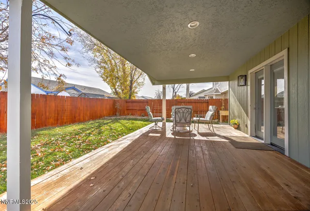 a view of a porch with wooden floor