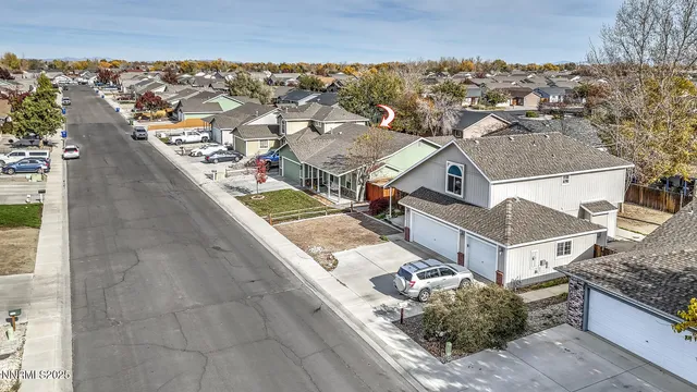 an aerial view of residential houses with outdoor space