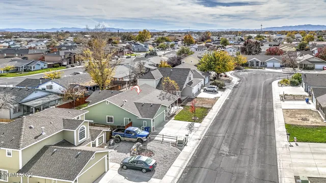 an aerial view of a house with a ocean view