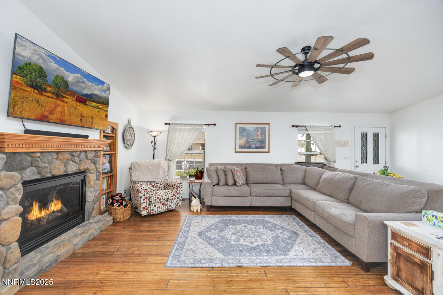738 Noel Lane Fallon, NV 89406 - Photo 4 of 31 a living room with furniture a fireplace with wooden floor