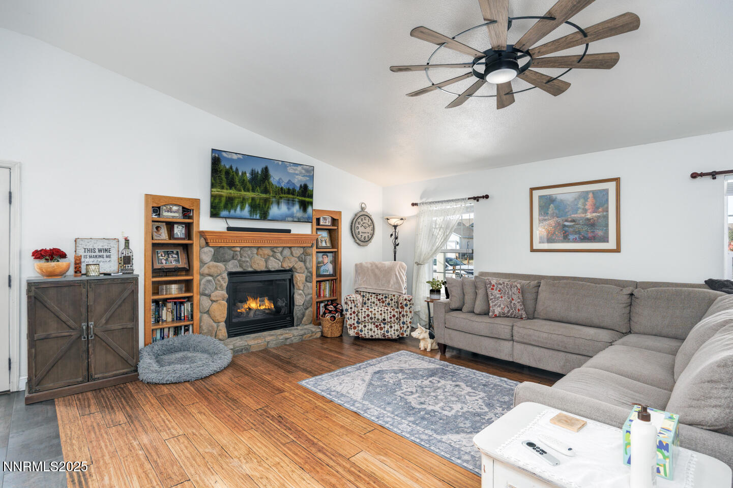 738 Noel Lane Fallon, NV 89406 - Photo 6 of 31 a living room with furniture a fireplace and a flat screen tv