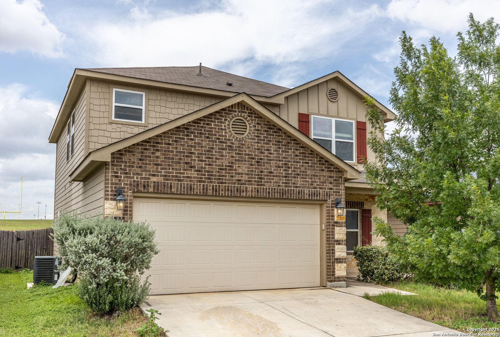 6703 Terra Ark Converse, TX 78109 - Photo 1 of 1 a front view of a house with a yard and garage