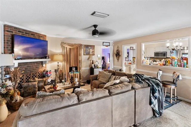 a very nice looking living room with furniture and a flat screen tv