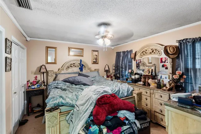 a bedroom with bed and furniture