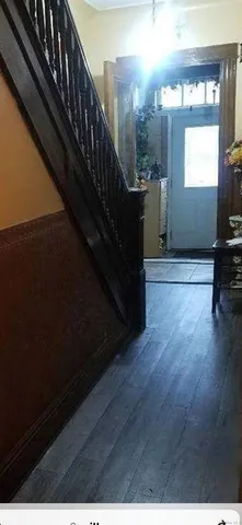 a view of entryway with wooden floor
