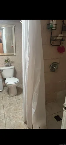 a bathroom with a toilet and a sink