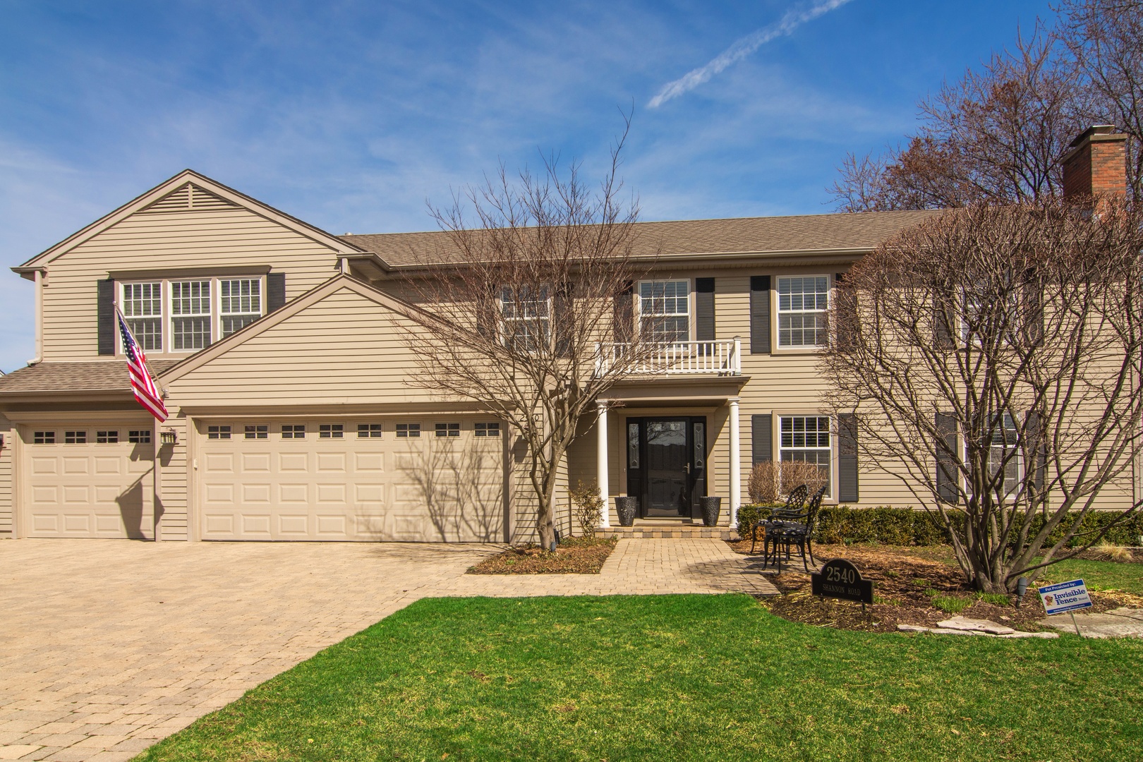 2540 Shannon Road Northbrook, IL 60062 - Photo 2 of 32 a front view of a house with a yard