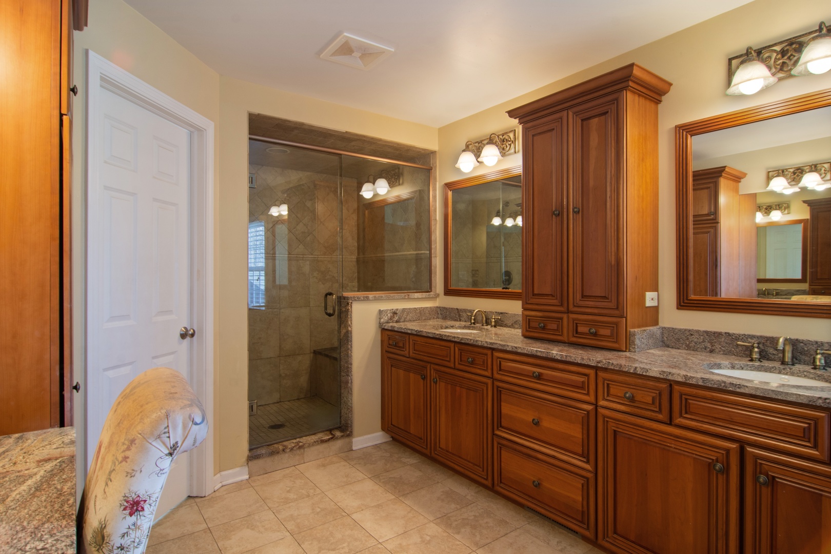 2540 Shannon Road Northbrook, IL 60062 - Photo 16 of 32 a spacious bathroom with a granite countertop sink mirror and a bathtub