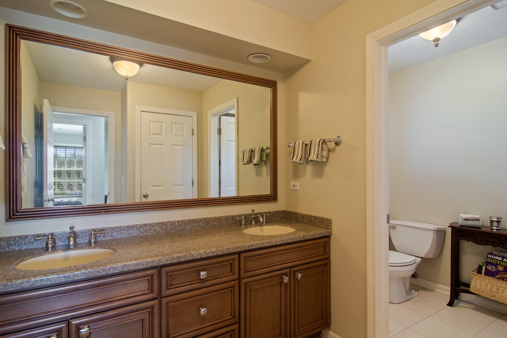 2540 Shannon Road Northbrook, IL 60062 - Photo 21 of 32 a bathroom with a granite countertop sink mirror and toilet