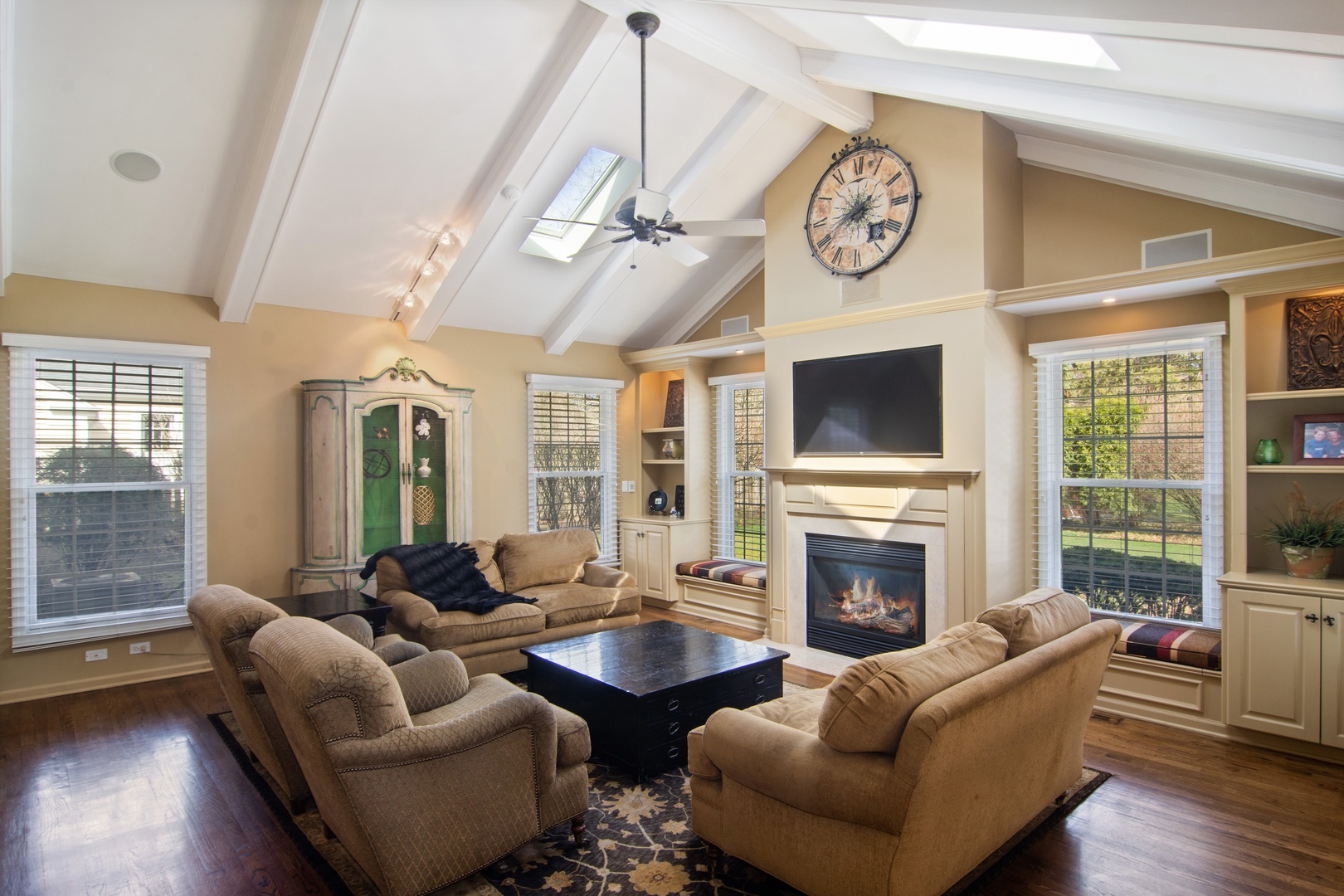2540 Shannon Road Northbrook, IL 60062 - Photo 10 of 32 a living room with furniture a fireplace and a flat screen tv
