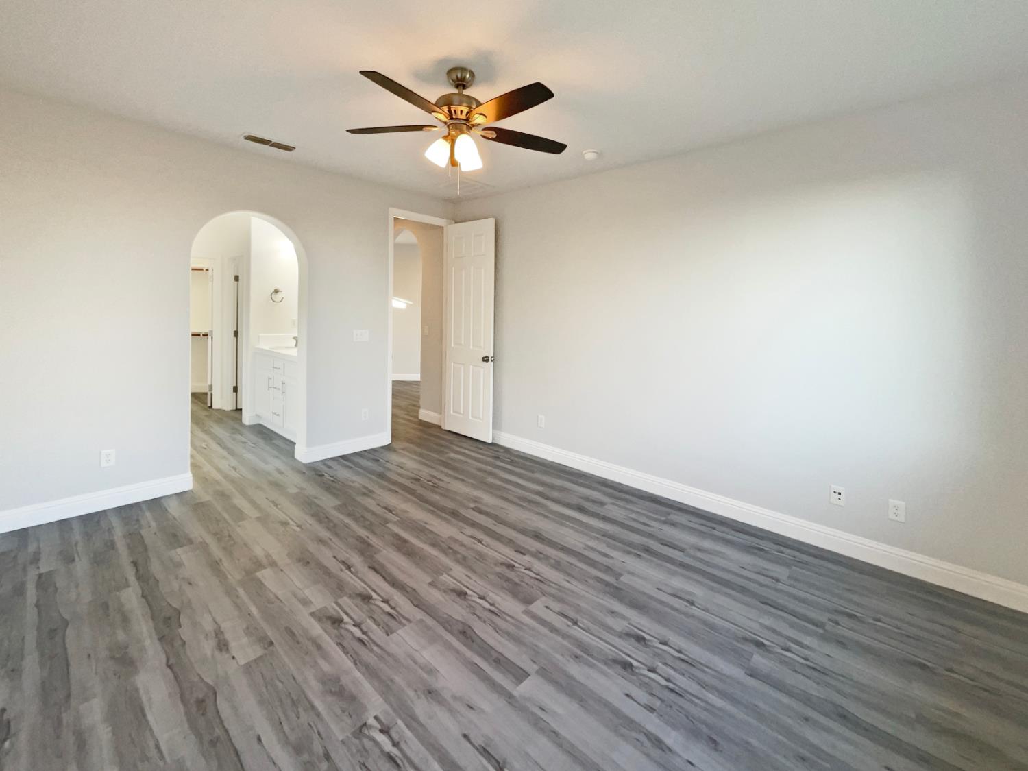 4087 Preserve Way Rancho Cordova, CA 95742 - Photo 11 of 24 an empty room with wooden floor and windows
