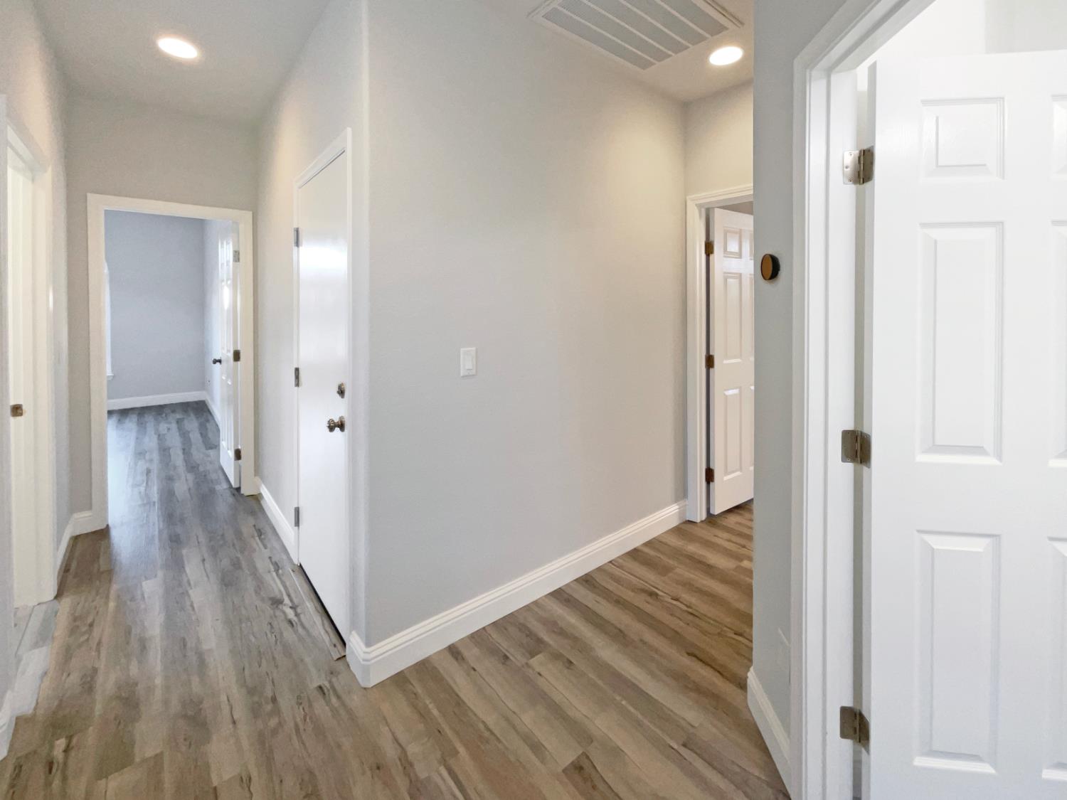 4087 Preserve Way Rancho Cordova, CA 95742 - Photo 14 of 24 a view of a hallway with wooden floor