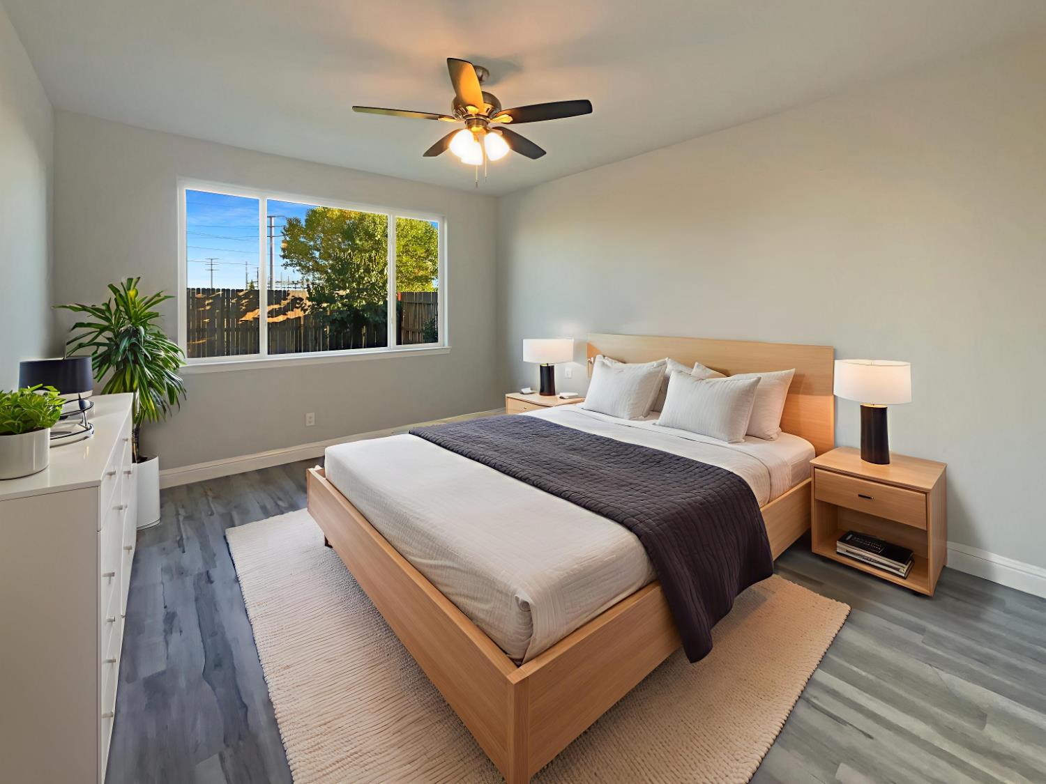 4087 Preserve Way Rancho Cordova, CA 95742 - Photo 4 of 24 a bedroom with a bed and a large window