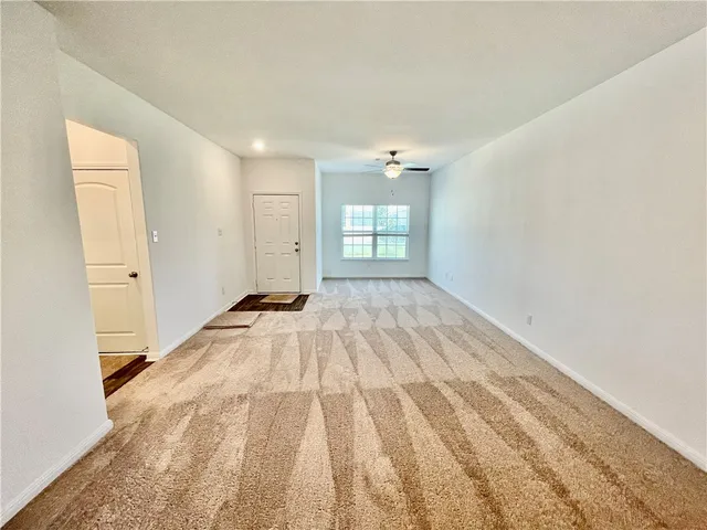 a view of an empty room and window
