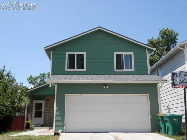 a front view of a house with a garage