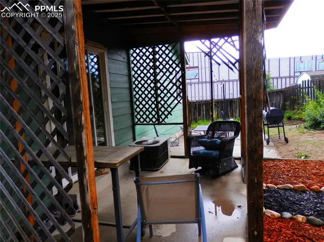 a workspace with furniture window and wooden floor