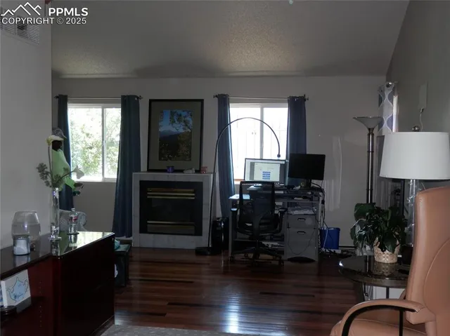 a view of a dining room with furniture and chandelier