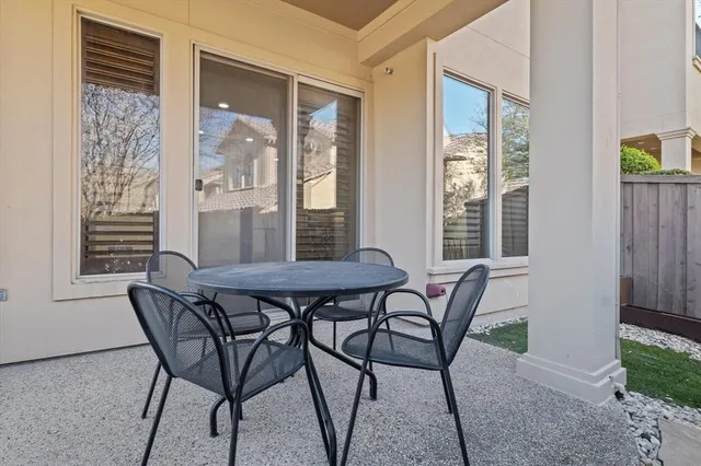 a view of a dining room with furniture wooden floor and a potted plant