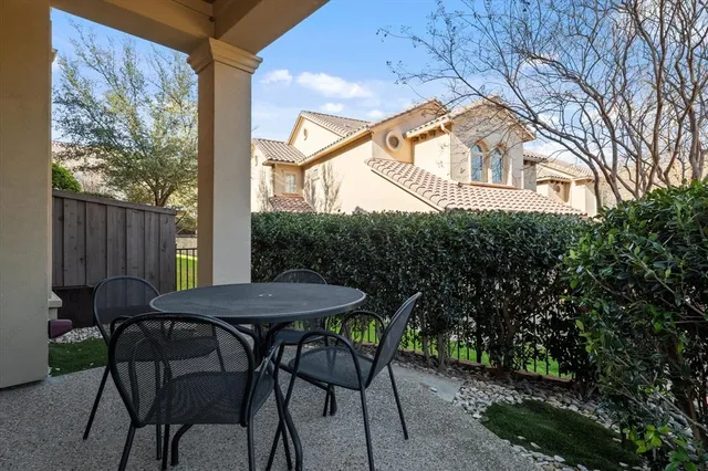 a view of a table and chairs in the patio