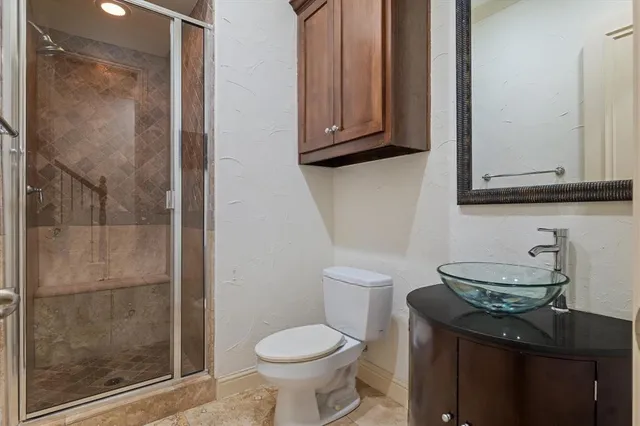 a bathroom with a toilet and a sink