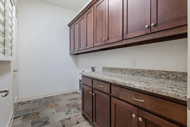 a kitchen with granite countertop cabinets and sink