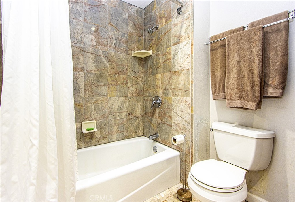 1830 Hawkbrook Drive San Dimas, CA 91773 - Photo 12 of 21 a bathroom with a toilet and a bathtub