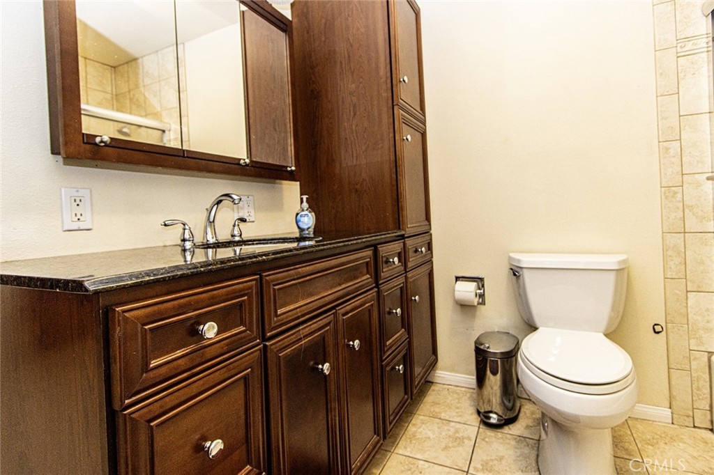 1830 Hawkbrook Drive San Dimas, CA 91773 - Photo 13 of 21 a bathroom with a sink a toilet and mirror