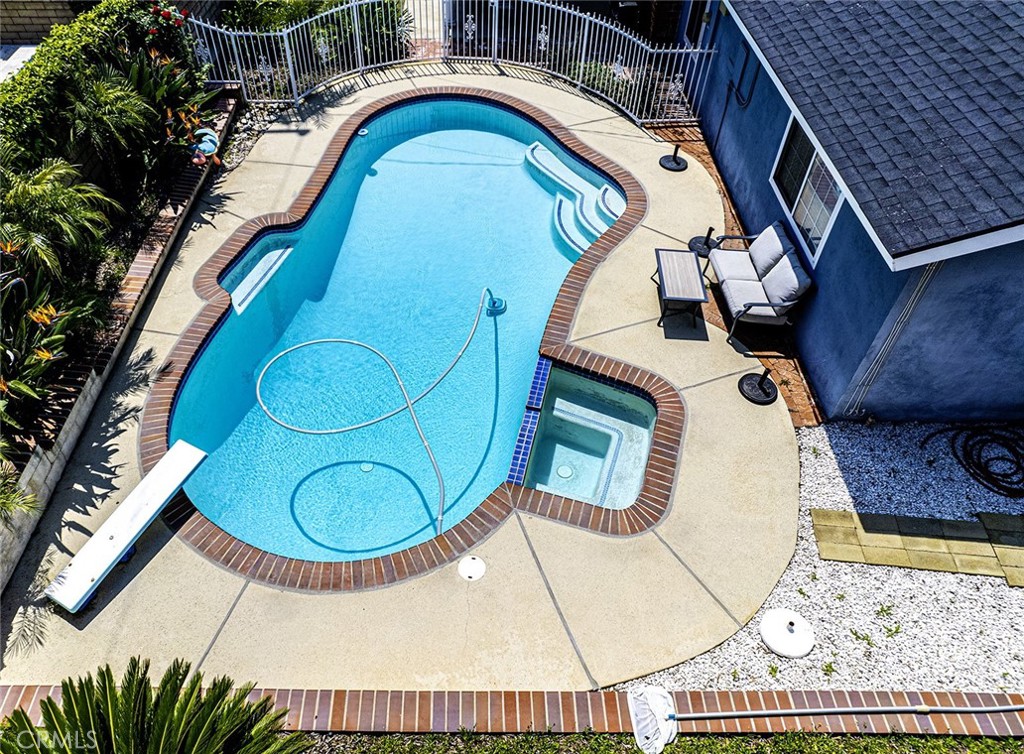 1830 Hawkbrook Drive San Dimas, CA 91773 - Photo 17 of 21 a view of swimming pool with a fireplace and rug