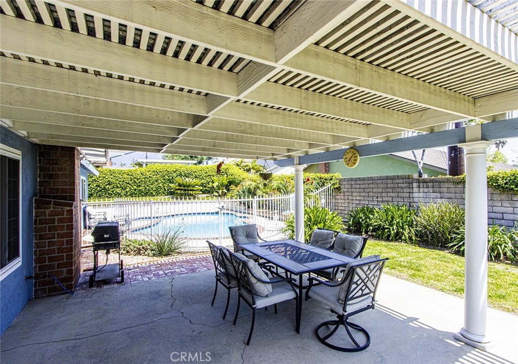 1830 Hawkbrook Drive San Dimas, CA 91773 - Photo 20 of 21 a view of a patio with a table chairs and a backyard