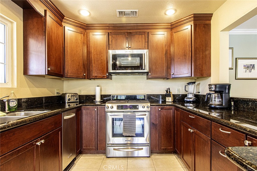 1830 Hawkbrook Drive San Dimas, CA 91773 - Photo 9 of 21 a kitchen with a sink a stove and cabinets