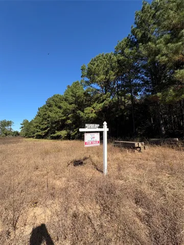 a sign board with lake view