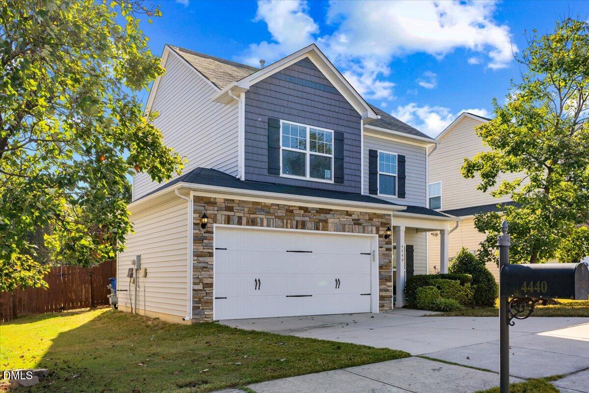4440 Cardinal Grove Boulevard Raleigh, NC 27616 - Photo 1 of 42 a view of a house with a yard