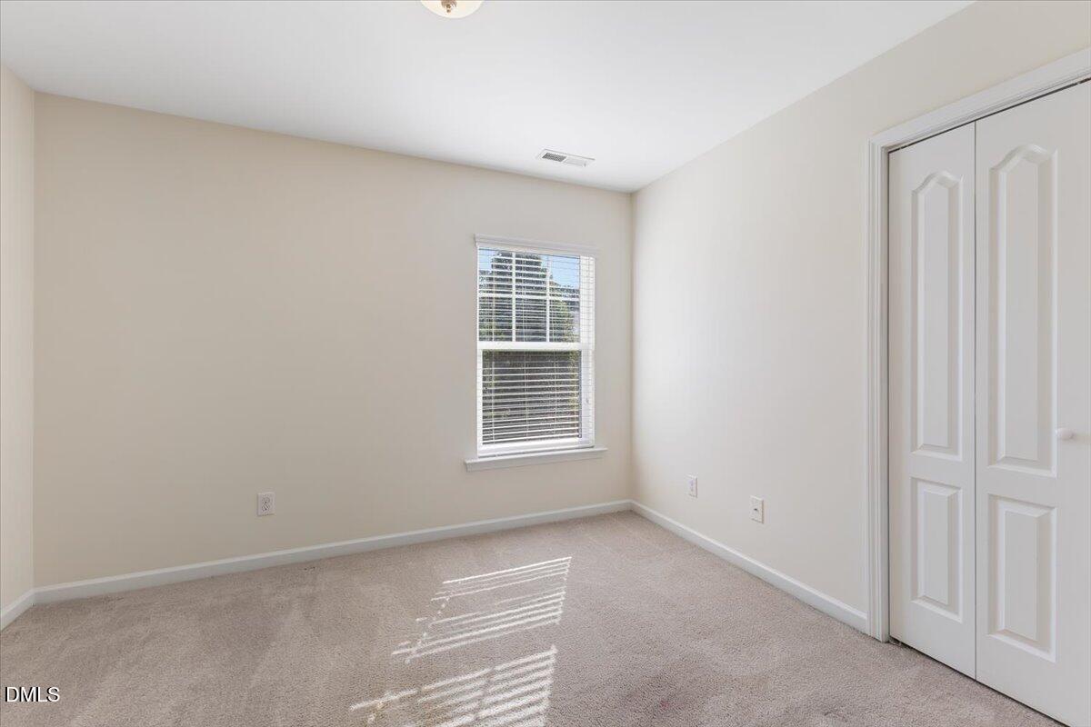 4440 Cardinal Grove Boulevard Raleigh, NC 27616 - Photo 14 of 42 a view of an empty room with a window