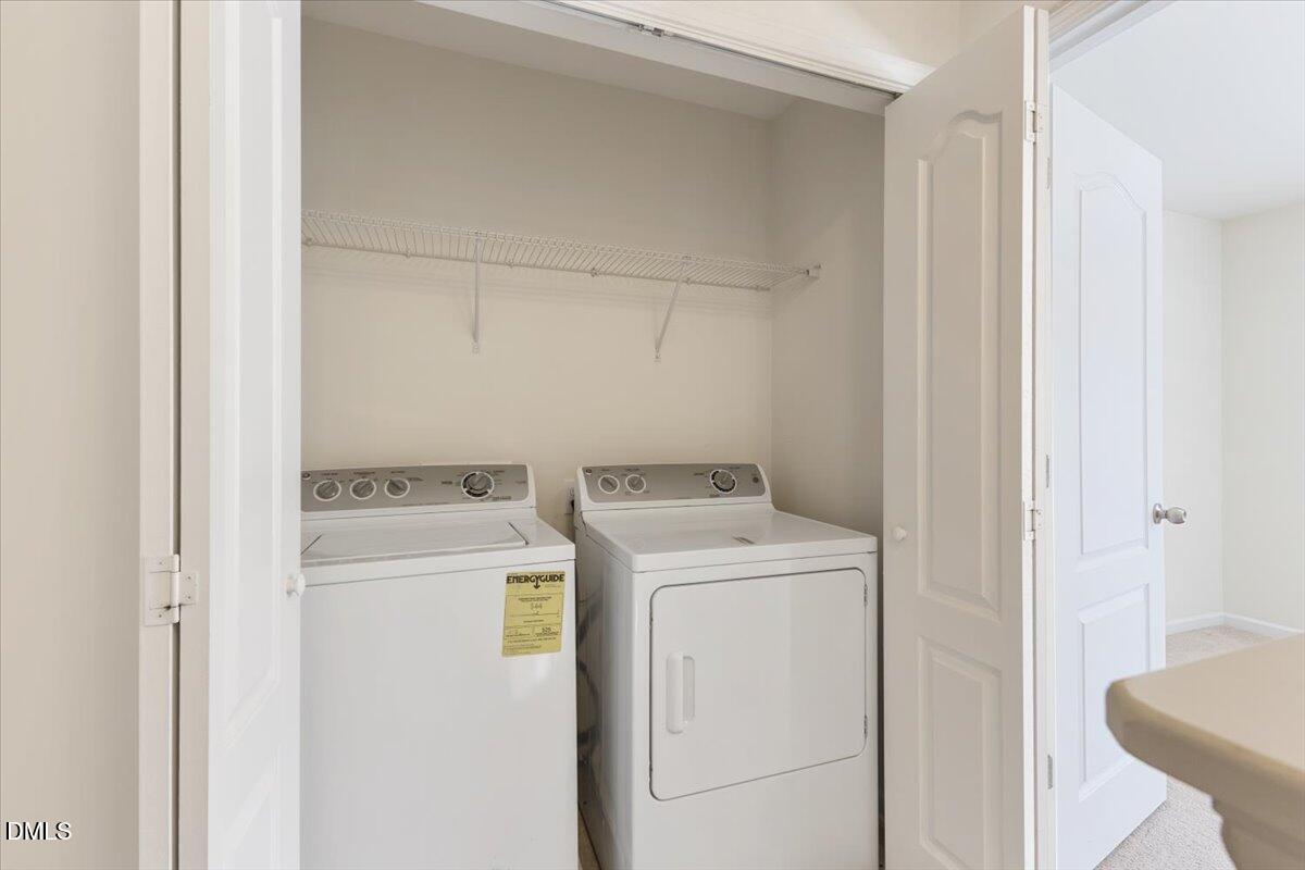 4440 Cardinal Grove Boulevard Raleigh, NC 27616 - Photo 17 of 42 a utility room with dryer and washer