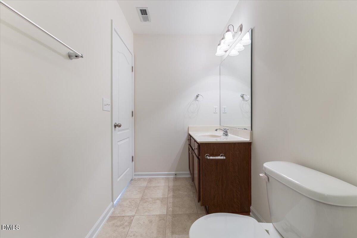 4440 Cardinal Grove Boulevard Raleigh, NC 27616 - Photo 27 of 42 a bathroom with a sink a toilet and shower