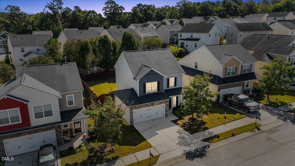 4440 Cardinal Grove Boulevard Raleigh, NC 27616 - Photo 42 of 42 an aerial view of multiple houses with a yard
